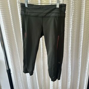 Discontinued Lululemon cropped leggings with open side pink detailing